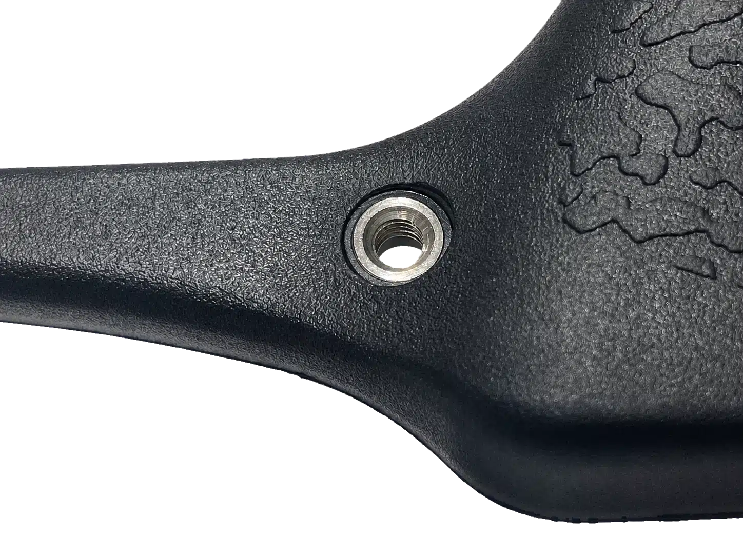 Threaded metal insert molded into a black engineered plastic component
