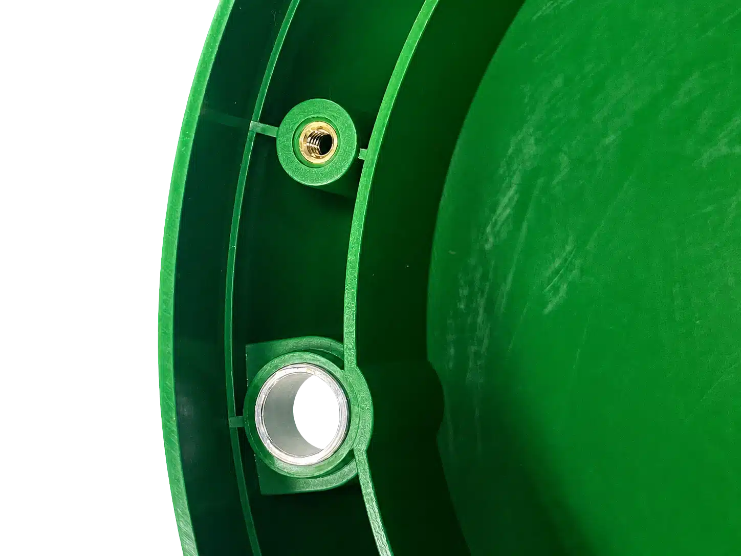 Through-hole and threaded inserts molded into a green engineered plastic component